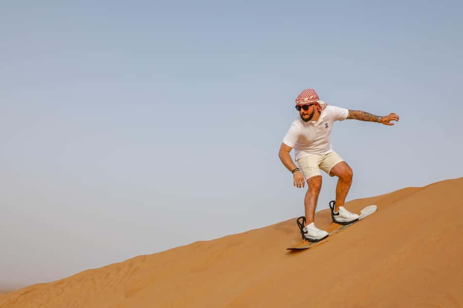 Dubai: Red Dunes Quad Bike with Sandboarding, Camels and BBQ - Arabic coffee, dates, and a cool start