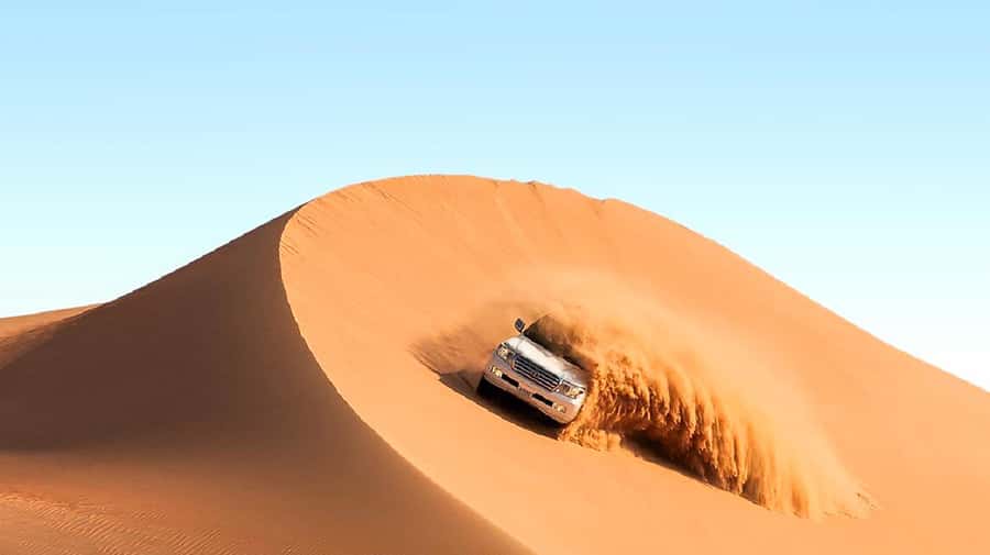 Dubai: Safari, Quad Bike, Camel Ride, and Buffet Dinner - Dune bashing across the Red Desert