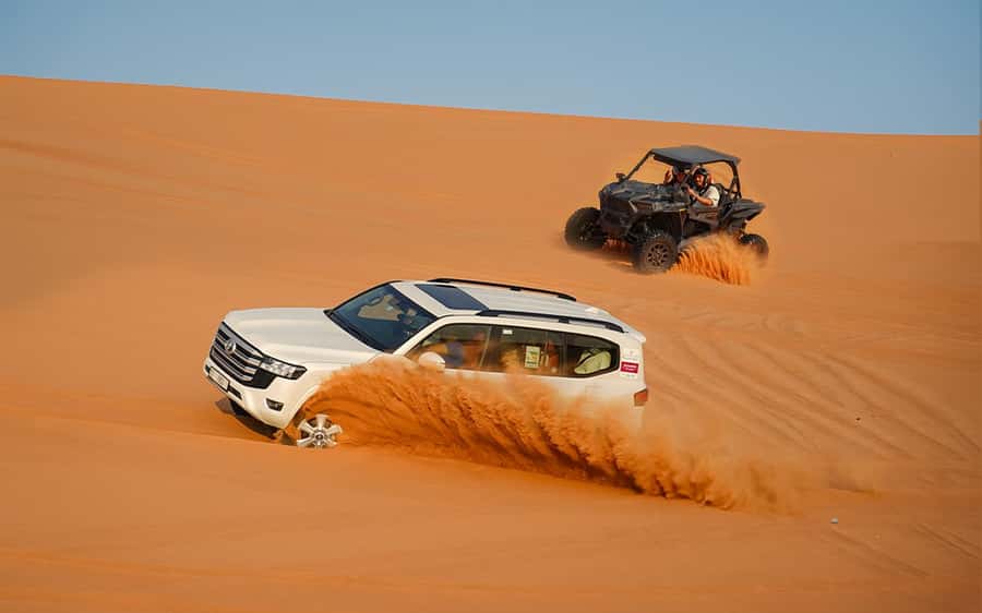 Dubai: Sandboarding, Camel Ride and Red Dune Bashing - Hotel pickup and the 30 to 45 minute drive