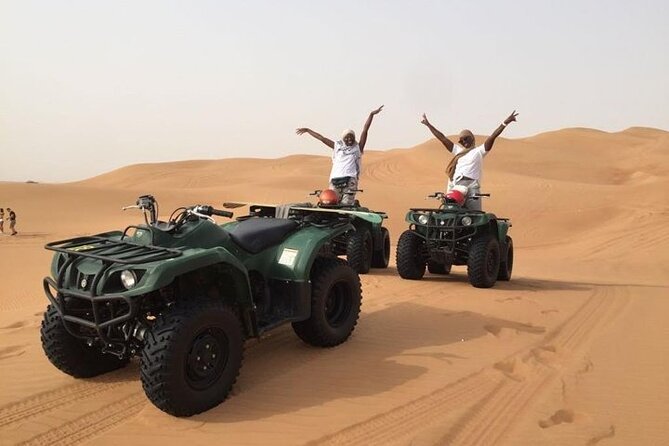 Dubai Self-drive Quad Bike, Sand Boarding, Camels & Refreshments - Sandboarding on the red dunes