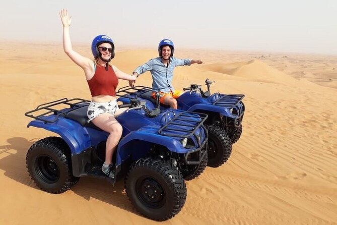 Dubai Self-drive Quad Bike, Sand Boarding, Camels & Refreshments - Taking control of the quad bike