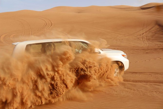 Dubai: Unique SUNSET 4WD Red Dunes Safari - Sandboarding and the slow camel ride