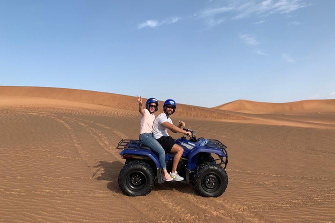 Dubai: Unique SUNSET Quad Bike Red Dunes Safari - The camel ride slows everything down