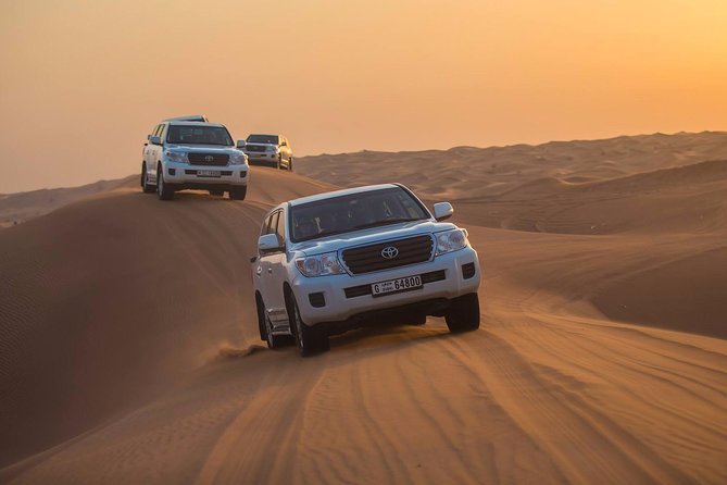 Evening Desert Adventure: Quad Biking, Sandboarding & Camel Ride - Arabic coffee, dates, and the evening camp