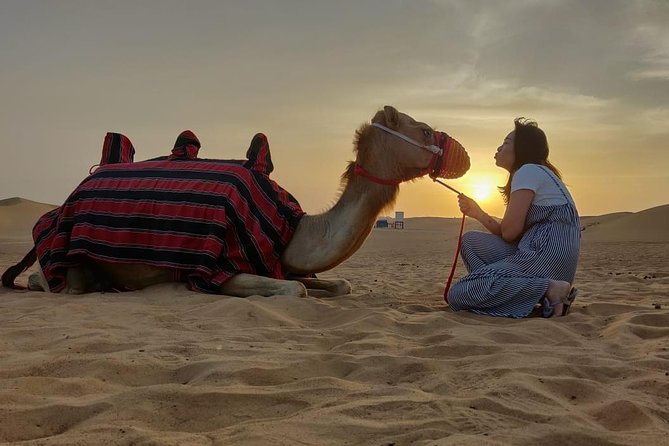 Evening Desert Safari in Dubai, Sandboard & BBQ Dinner - Fire, Tanoura, and belly dance after dark