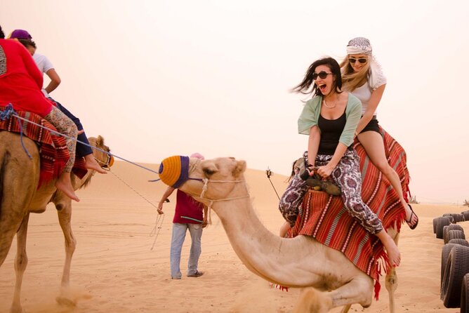 Evening Dubai Safari with BBQ, Dance Shows & Quad Biking optional - A short camel ride at the camp