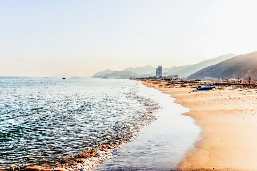 From Dubai: Snorkeling Trip to Dibba Al-Fujairah - Snoopy Island and Dibba Rock in the water