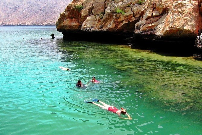 Full Day Musandam Dibba Cruise with Buffet Lunch and Snorkelling - Boarding the traditional dhow at Dibba Port