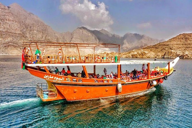 Full Day Musandam Dibba Cruise with Buffet Lunch and Snorkelling - Snorkeling, swimming, and the banana boat stop