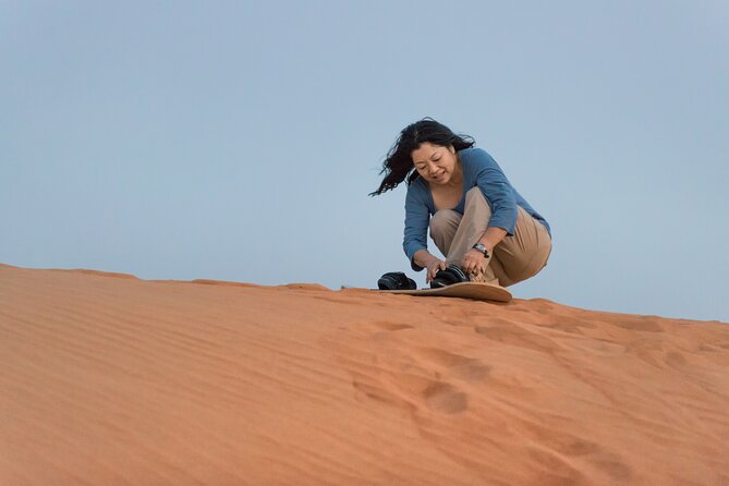 Morning Desert Safari plus Quad Bike, Sandboard and Camel ride - Sandboarding turns the dune into a playground