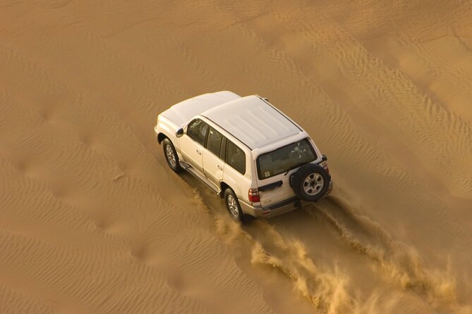 Morning Desert Safari plus Quad Bike, Sandboard and Camel ride - A short camel ride with cultural context