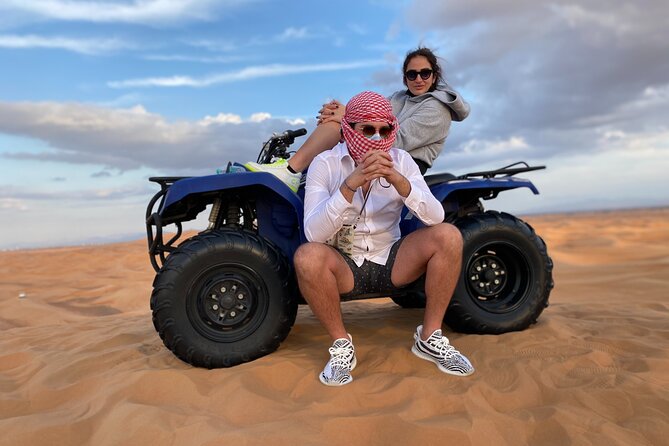 Morning Desert Safari, Quad Bike, Sandboard and Camel Ride - A 4x4 run over the red dunes