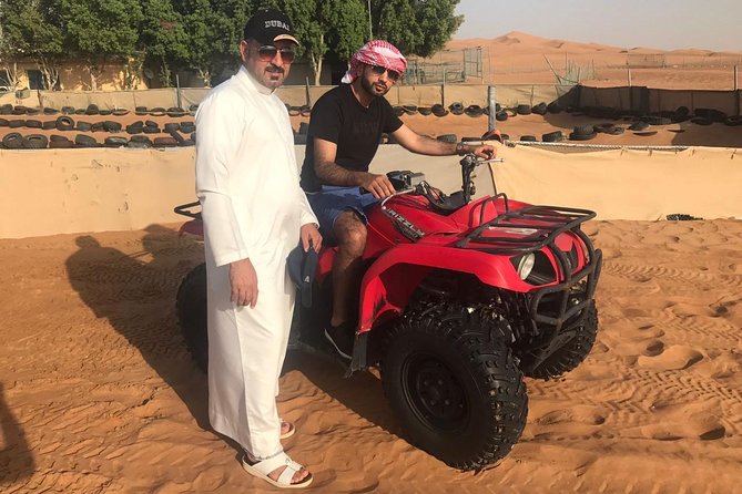 Morning Dubai Desert Safari with Sand boarding and Camel Ride - Sandboarding on the Golden Dunes
