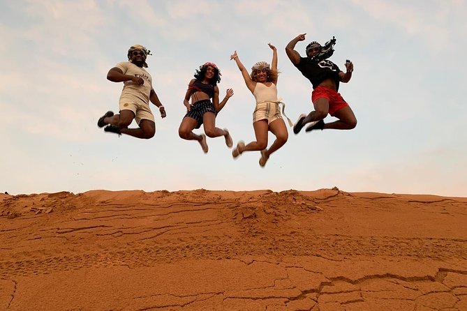 Morning Dune Bashing With Sand Boarding And Camel Ride in Red Dunes Desert - The 30 to 40 minute dune-bashing run