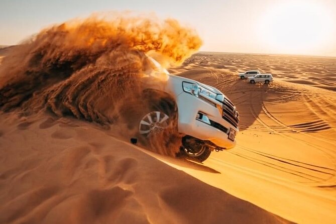 Morning Quad Biking & Red Sand Desert Safari , Camel Ride, Sand Boarding - Dune bashing: a rough introduction to the desert