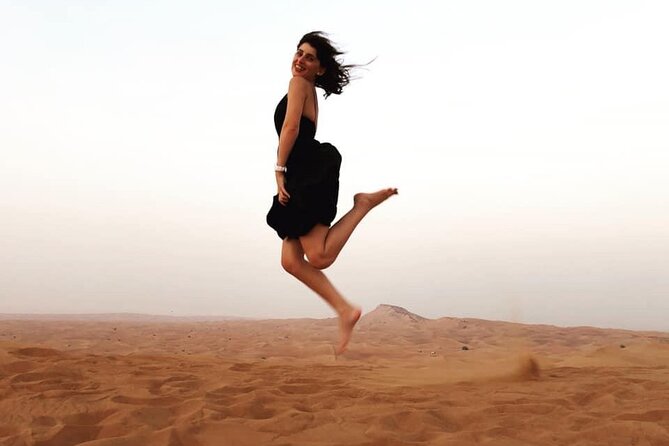 Morning Red Dunes Safari: Camel Ride & Sandboarding Adventure - A short camel ride with a tourist-style setup
