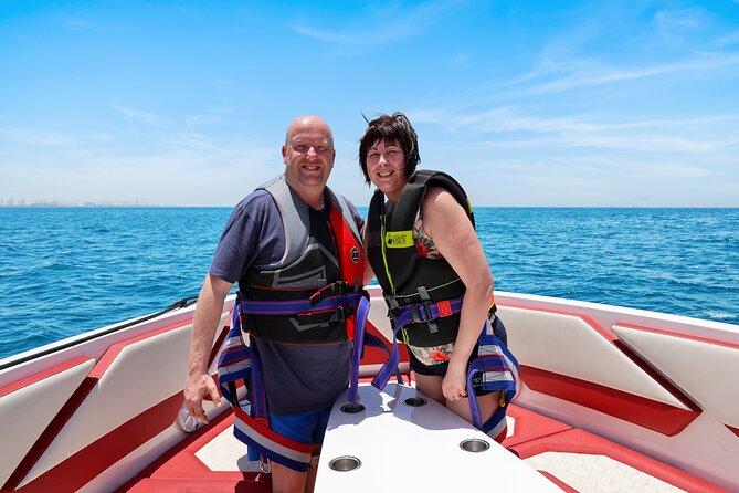 Parasailing in Dubai with Palm Jumeirah and JBR Beach views - Weather, safety, and cancellation details