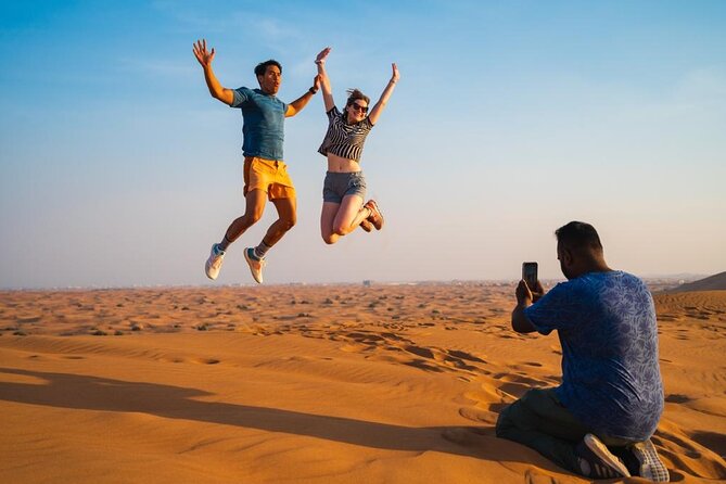 Premium Evening Desert Safari, Quad Bike, Camel & VIP BBQ Dinner - Sandboarding and desert photographs