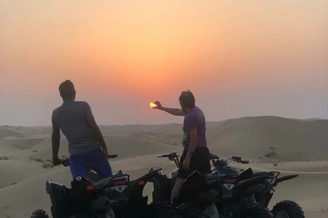 Quad biking tour with or without pick and drop(Abu dhbai ) - Following the guide vehicle over dunes and plains