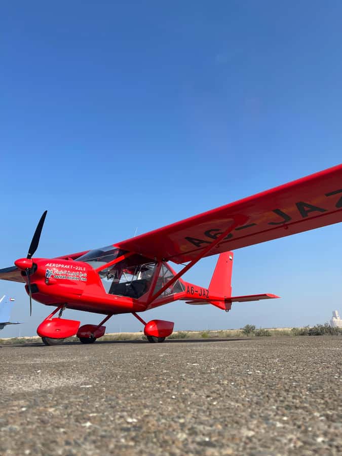 Ras Al Khaimah: Scenic Microlight Adventure Over Desert - Getting a turn at the controls
