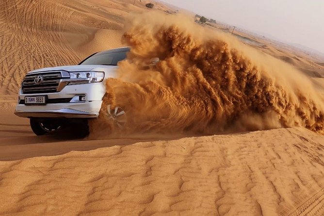 Red Dune Safari Adventure with BBQ Dinner Experience - The drive from Dubai and the first desert stop