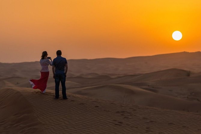 Red Dunes Desert Safari with BBQ Dinner - Sandboarding on the red dunes