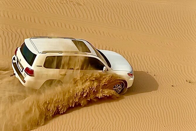 Sunrise Desert Safari from Abu Dhabi - Sand boarding on the dunes