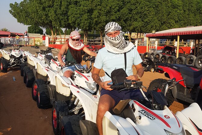 Sunrise Desert safari With Quad bike ride Sandboard & Camel ride - A photo stop in the middle of the desert