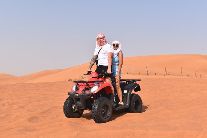Sunset Desert Safari Quad bike Camel ride Sand Board & BBQ Dinner - Key points at a glance