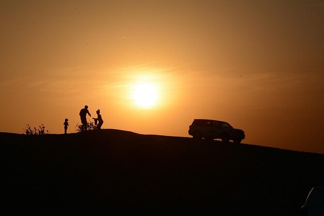 Sunset Evening Safari,Camel ride,live shows and BBQ Dinner with No Hidden Charge - Sandboarding and sunset photographs